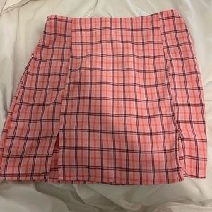 Pink plaid skirt.